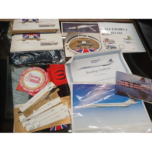 82 - A box of Concorde related ephemera including baggage labels, menus, model plane, etc