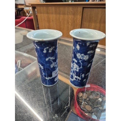 454 - A pair of Chinese blue and white sleeve vases, bearing four character Kangxi marks, height 15cm.