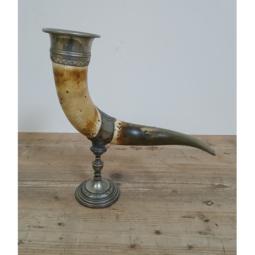 259 - A German drinking horn by WMF, cow horn with silver plate3d mounts, height 39cm.