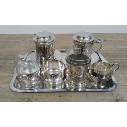 265 - A Russian silver plated coffee set and another.