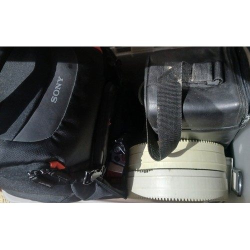 324 - Two boxes of cameras and accessories.