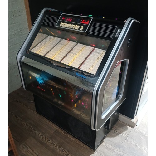 331 - A 1983 Wurlitzer Fuego jukebox, appears in working order and complete with contents.