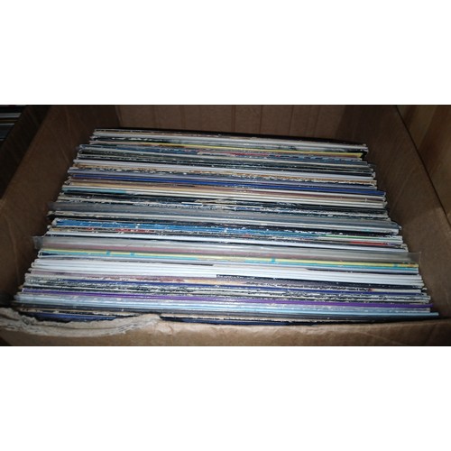 487 - A box of over 50 rock and pop albums and 20 twelve inch singles from the eighties to include Queen, ... 