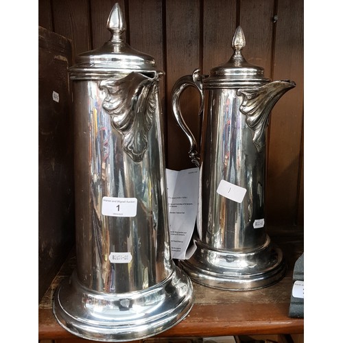 1 - A pair of ecclesiastical silver plated church wine and water flagons, heights 35cm, James Dixon & So... 