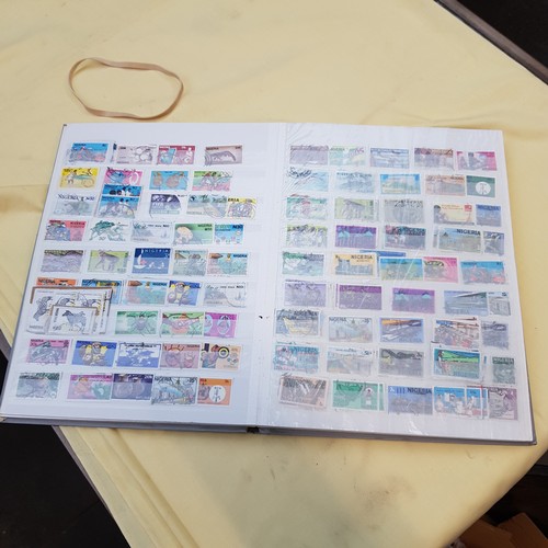 32 - A full stamp album containing UK and Commonwealth stamps.