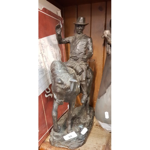 50 - A bronze sculpture of cowboy on horse - marked Arnoux Paris