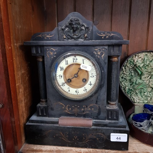 44 - A slate mantle clock bearing inscription dated 1887