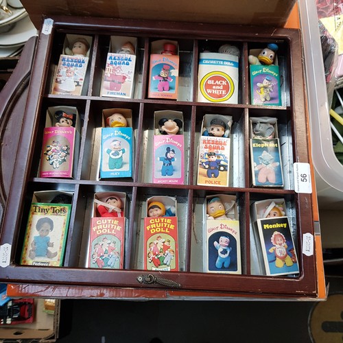 56 - A display case of toys including Walt Disney, Rescue Squad, Bestoy, etc.