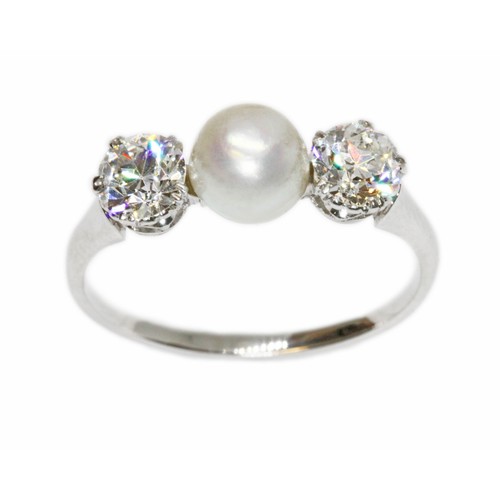 4 - A DIAMOND AND CULTURED PEARL RING, the central slight button shaped pearl measuring approximately 6.... 