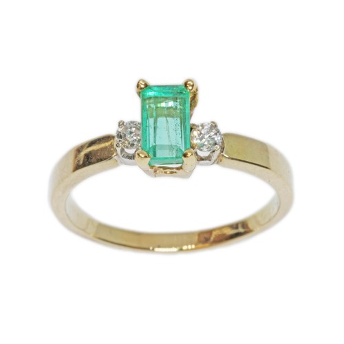 7 - An emerald and diamond ring, the emerald measuring approximately 7.15mm x 4.20mm, depth 3.12mm, set ... 