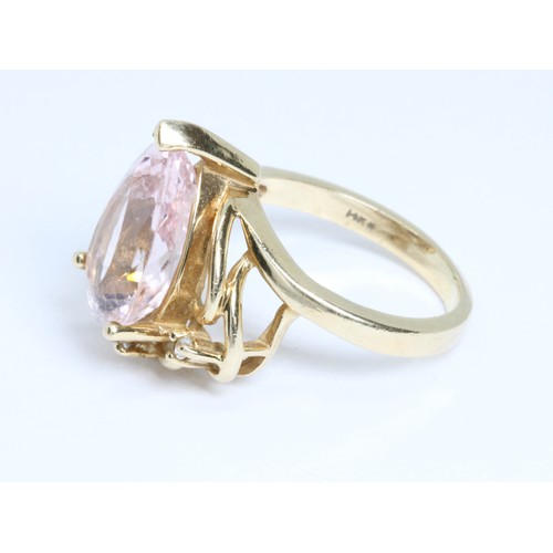 18 - A morganite and diamond cluster ring, the pear shaped pink beryl weighing approximately 4.60ct, mark... 