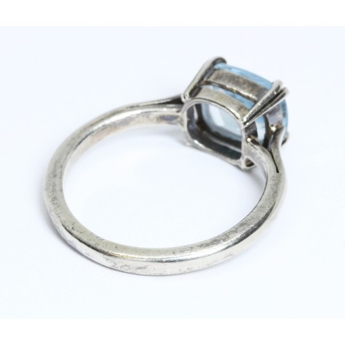 19 - An aquamarine ring, the cushion cut blue beryl measuring approximately 8.68mm x 7.25mm and depth 4.4... 