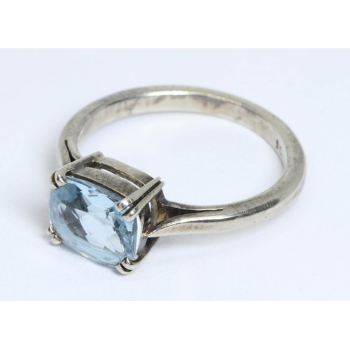 19 - An aquamarine ring, the cushion cut blue beryl measuring approximately 8.68mm x 7.25mm and depth 4.4... 