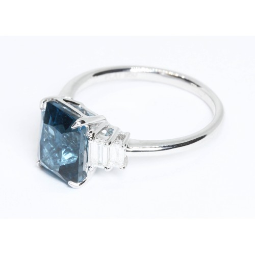 21 - A 'London Blue' topaz and diamond ring, hallmarked platinum, sponsor LMJ, 950, gross weight 4.8g, si... 