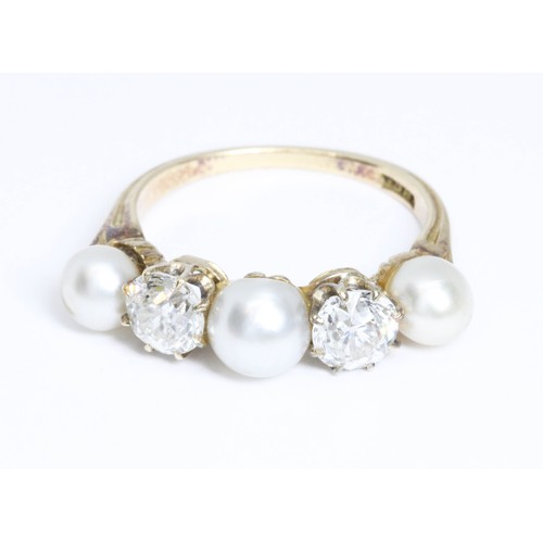 32 - AN ANTIQUE DIAMOND AND PEARL RING, two old European cut diamonds weighing approximately 0.58ct and 0... 