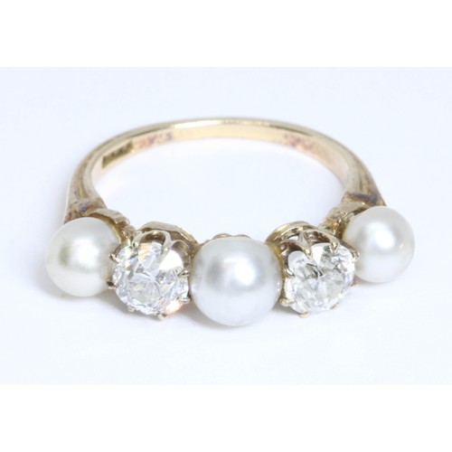 32 - AN ANTIQUE DIAMOND AND PEARL RING, two old European cut diamonds weighing approximately 0.58ct and 0... 