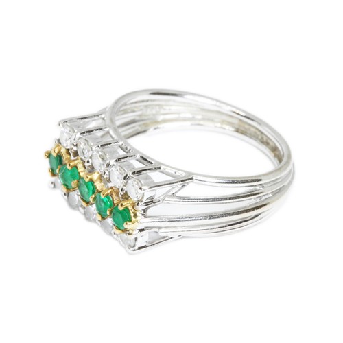 50 - A DIAMOND AND EMERALD RING, ten round brilliant cut diamonds weighing approximately 0.50ct in total,... 