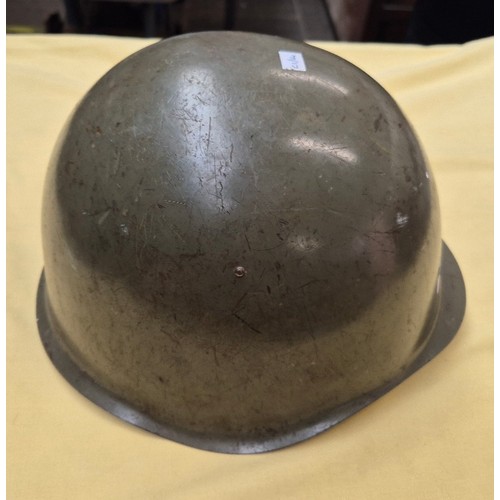 15 - WW11 British steel helmet dated1939 together with an American steel helmet.