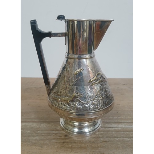 482 - A silver plated jug attributed to Christopher Dresser for Richard Perry, Son & Co, embossed decorati... 