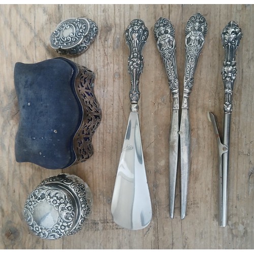 499 - A mixed lot of Hal;lmarked silver comprising a pin cushion/trunket box, glove stretchers, shoe horn,... 