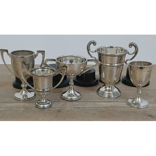 506 - A group of five hallmarked silver trophies, weight 9oz 16dwt.