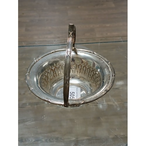 505 - A hallmarked silver basket with swing handle, Walker & Hall, height 12.5cm, weight 5oz 2dwt.