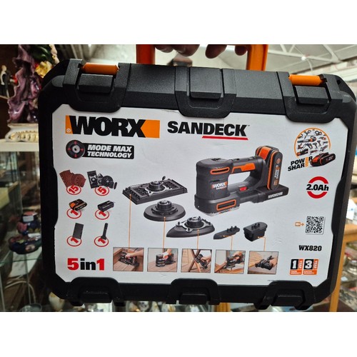 64 - A Worx Sandeck cordless sander with battery and charger