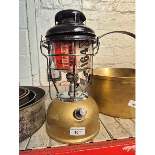 104 - A gold coloured Tilley lamp