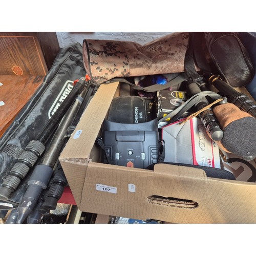 107 - 4 camera/theodolite  tripods including K and F Concept and a Draper, together with a box of cameras,... 