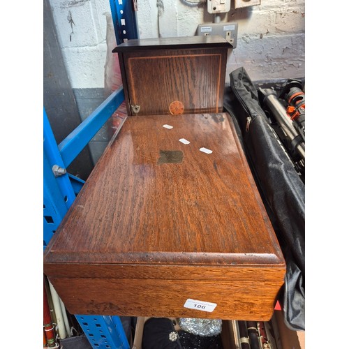 106 - A smokers box and a wooden canteen of cutlery