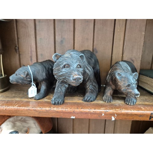 97 - Three Black Forest carved wood bears.