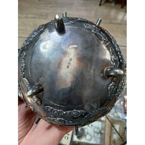 182 - A Chinese silver spirit kettle, decorated with clouds and two dragons, bamboo handle, spout and stan... 