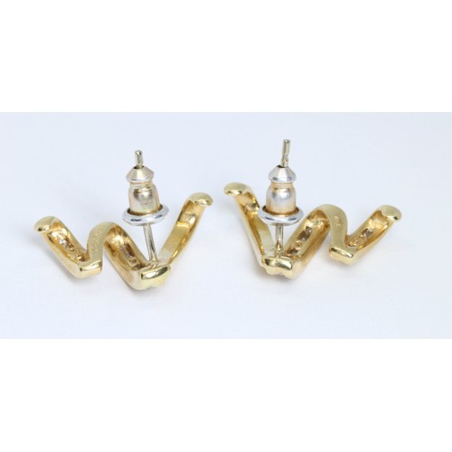 38 - DAVID M ROBINSON, a pair of 18ct gold diamond earrings, trail design with channel set round brillian... 