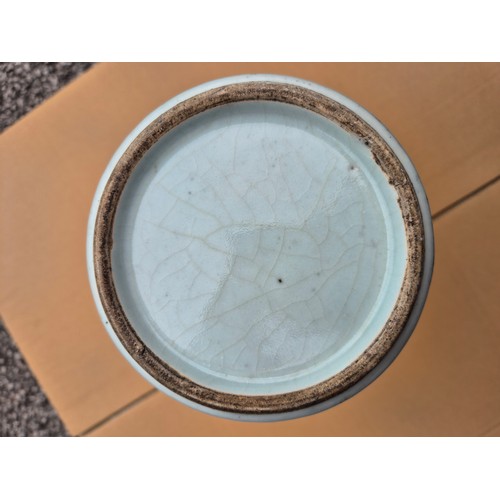 614 - A Chinese porcelain baluster vase decorated in red and blue underglaze depicting a dragon amongst cl... 