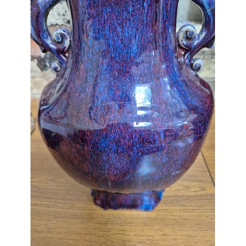 613 - A Chinese porcelain flambe glaze baluster vase with dragon handles, unmarked, 18th/19th century, hei... 