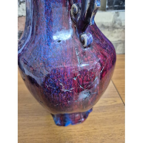 613 - A Chinese porcelain flambe glaze baluster vase with dragon handles, unmarked, 18th/19th century, hei... 