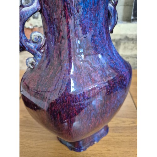 613 - A Chinese porcelain flambe glaze baluster vase with dragon handles, unmarked, 18th/19th century, hei... 