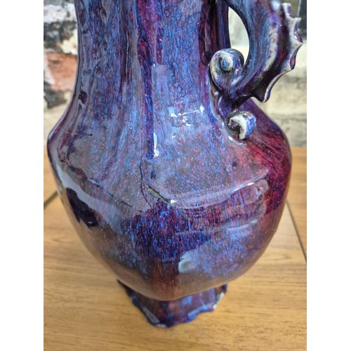 613 - A Chinese porcelain flambe glaze baluster vase with dragon handles, unmarked, 18th/19th century, hei... 