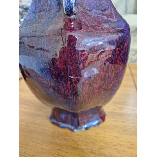 613 - A Chinese porcelain flambe glaze baluster vase with dragon handles, unmarked, 18th/19th century, hei... 