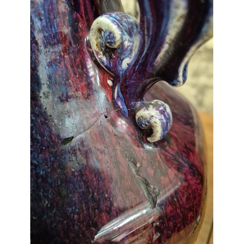 613 - A Chinese porcelain flambe glaze baluster vase with dragon handles, unmarked, 18th/19th century, hei... 