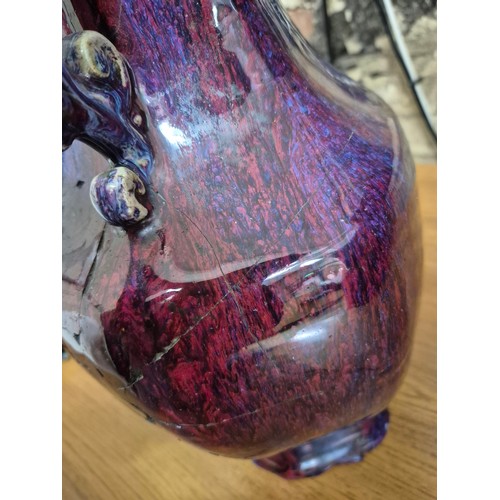 613 - A Chinese porcelain flambe glaze baluster vase with dragon handles, unmarked, 18th/19th century, hei... 