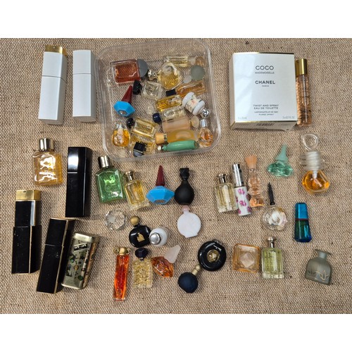 54 - A box of perfumes including Chanel, Armani etc