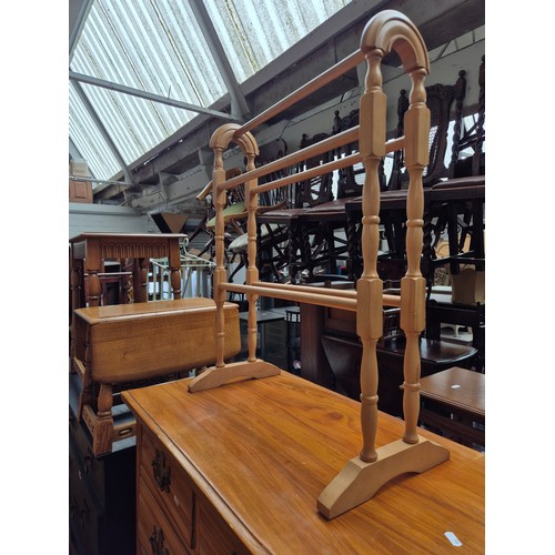 Two antique chests of drawers and two towel rails.