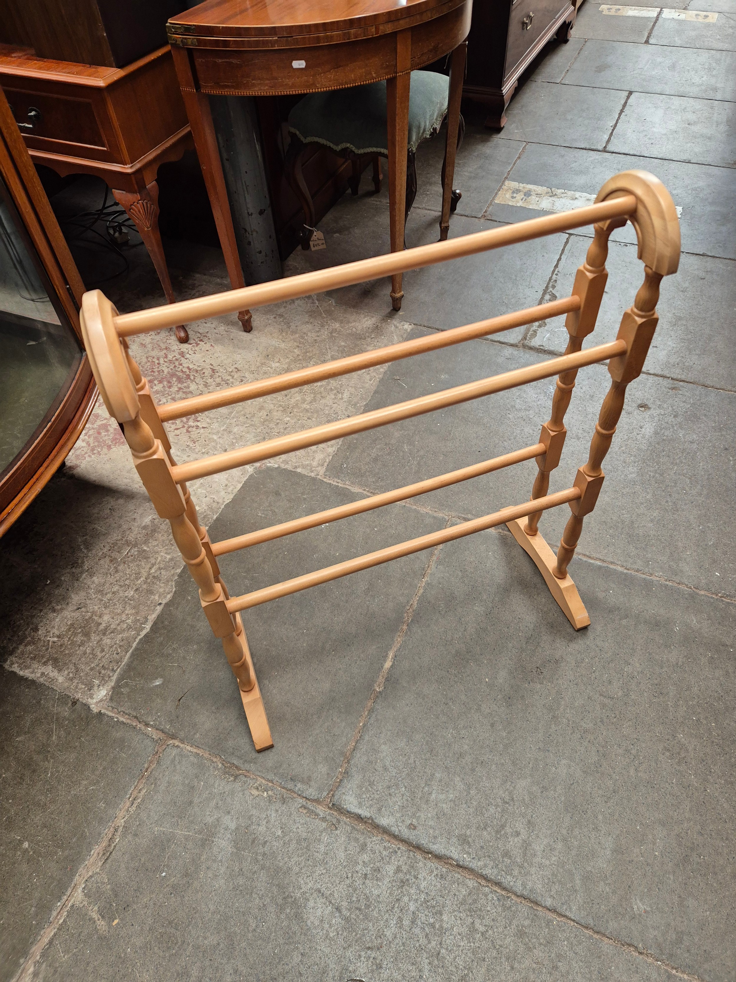 Two antique chests of drawers and two towel rails.