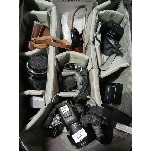 440 - A Lowepro camera bag and contents including a Lumix G, a Kodak Rettinette IA, various camera accesso... 