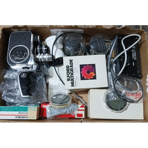 447 - A Bolex cine camera with various accessories.