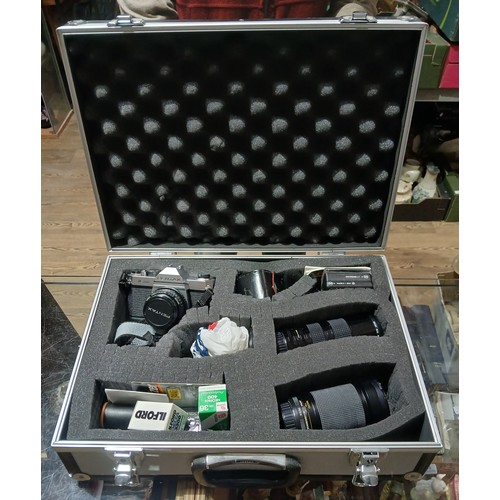 451 - A Pentax K1000 with case and accessories.