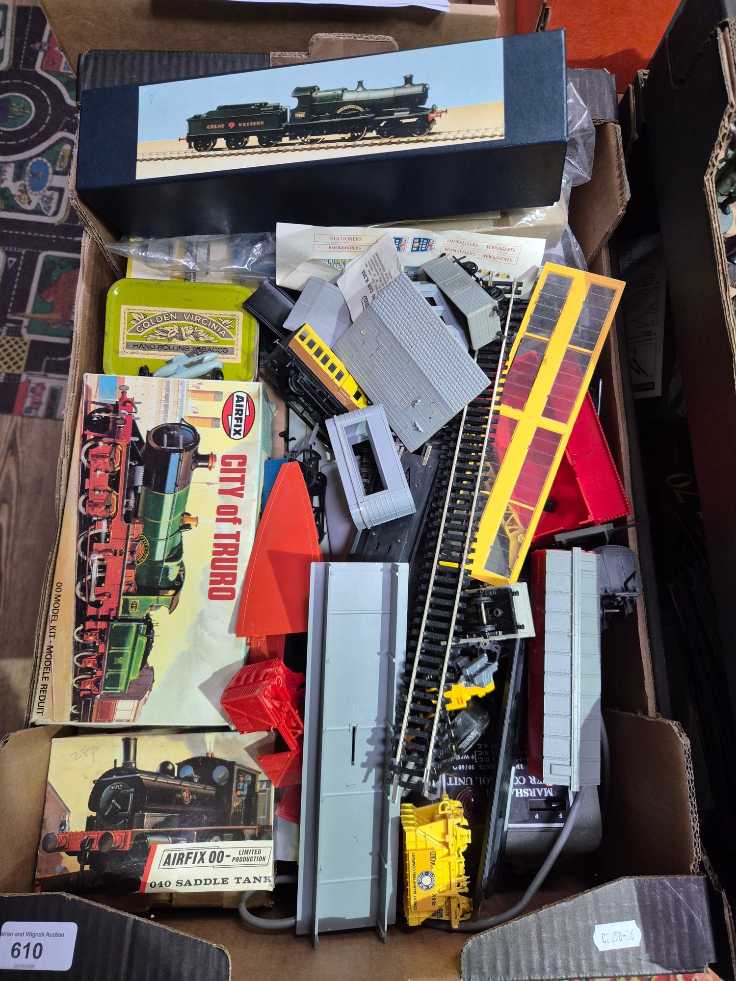 A box of model railway items including locomotives, carriages, etc.