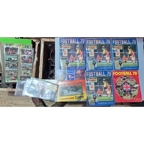 634 - Five Panini football sticker albums and assorted mainly Isle of Man TT phones cards.