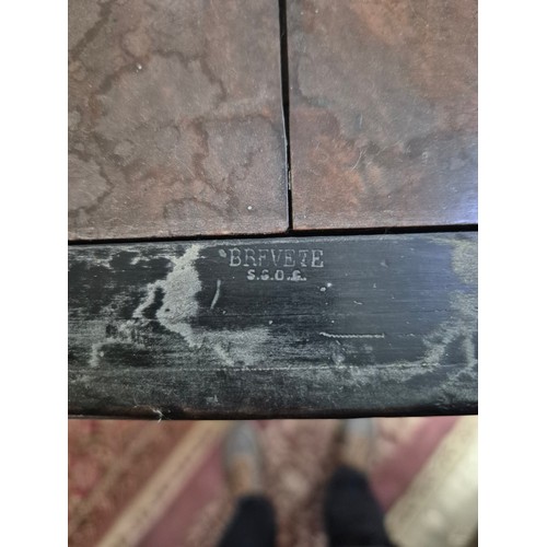 425 - A Victorian walnut floor standing stereoscopic viewer, partially filled with slides, height 121cm.